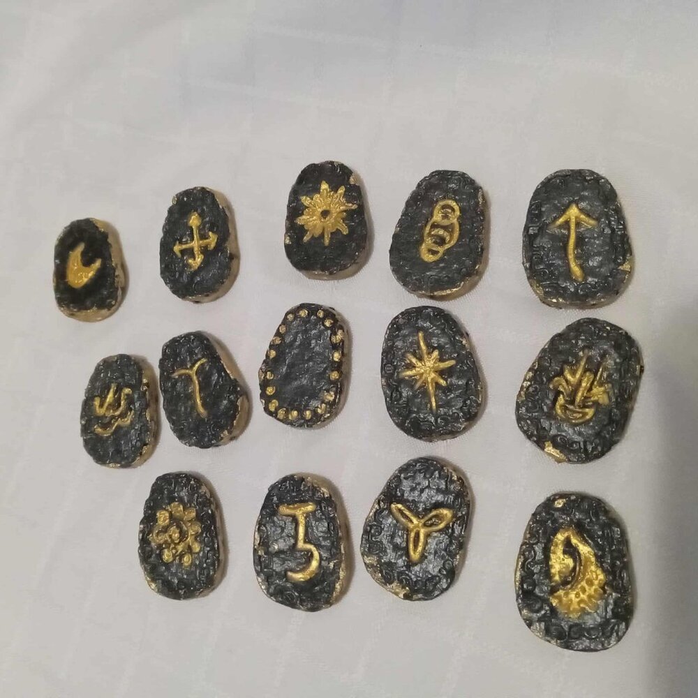 Set of handmade runes and symbols made from homemade paper painted and varnished
